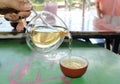 People pouring tea