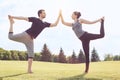 People practice acro yoga outdoors healthy lifestyle