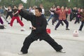 People practice tai chi chuan gymnastics in Beijing, China.