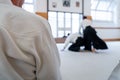 People practicing aikido in a dojo background. Royalty Free Stock Photo