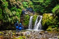 People practicing canyoning in the Natural Park of Ribeira dos Caldeiroes in Azores Royalty Free Stock Photo