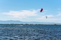 People practicing kite Surfing in Platja del Trabucador in the Delta del Ebro, Tarragona, Spain in summer 2020