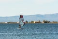 People practicing kite Surfing in Platja del Trabucador in the Delta del Ebro, Tarragona, Spain in summer 2020