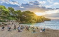 People practicing yoga at sunset time, Palma Mallorca Island, Spain