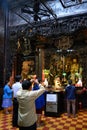 Asian people praying in Buddhist and Taoist Temple Jade Emperor Pagoda, Ho Chi Minh City, Vietnam.