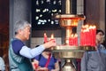 People praying with candles at temple in Melaka, Malaysia Royalty Free Stock Photo