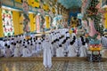 People praying in Cao Dai Temple in Vietnam