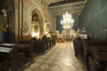 People praying in the Greek Catholic Holy Cross Cathedral. Uzhgorod, Ukraine