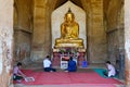 People praying inside the Dhammayangyi Temple in Bagan, Myanmar Royalty Free Stock Photo