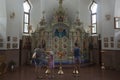 People praying in a temple in honor of the icon Mother of God Semistrelnaya in the Trinity-Georgievsky female monastery