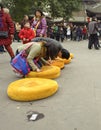 People praying to Buddha in temple