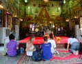 People praying at Wat Suthat Thepwararam in Bangkok