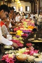 People prepare the offering in front of the relic of Temple of t