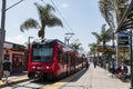 People Prepare to Board San Diego Trolley Near Mexico Border