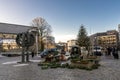 People prepare to set up a small Christmas market near Stavanger Cathedral early in the morning