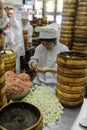 People preparing dim sum Shanghai style steamed pork dumplings c Royalty Free Stock Photo