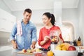 People preparing fruit milkshake