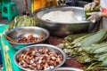 People preparing ZhongZi - traditional Chinese rice dish in bamboo leaves Royalty Free Stock Photo