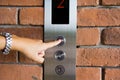 People pressing elevator button Royalty Free Stock Photo