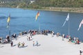 people promenade at river Rhine in Koblenz at Deutsches Eck or German Corner in Koblenz, where the Mosel river joins the Rhine