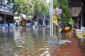 People are protecting their homes and businesses with sand bags in a flooded street of Bangkok, Thailand, on 30 November 2011