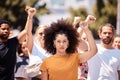 People protest for freedom, support fist for climate change or black power empowerment in Los Angeles. Young woman Royalty Free Stock Photo