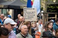 People protesting againstthe sanitary pass with text in frech :  abrogation du pass vaccinal, en english : cancellation of the vac Royalty Free Stock Photo