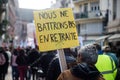 people protesting with placard in french : on ne battra pas en retraite, in english : we won