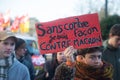 people protesting with placard in french : sans contre facon je suis contre macron, in