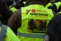 People protesting in the street against taxes and rising fuel prices with picture of Macron president dictator