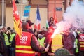 People protesting in the street against taxes and rising fuel prices with smoke