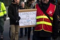 People protesting in the street with placard in french : changeons de modele socail, in