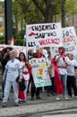 People from public service protesting with flags against the lower wages and new reforms from the government Royalty Free Stock Photo