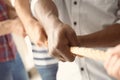 People pulling rope together, closeup of hands Royalty Free Stock Photo