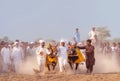 People of Punjab village in white clothing in Bull Karah race - rural event in Pakistan