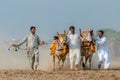 People of Punjab village in white clothing in Bull Karah race - rural event in Pakistan