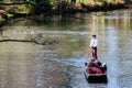 People punting on the Avon river Christchurch