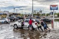 People Push Stalled Vehicle