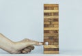 People put up stacking a wood block, Business building success, plan and strategy of business concept. risk of business. Royalty Free Stock Photo