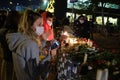 People putting Carnation flowers and lighting candles in memory of those who lost their lives on the earthquake 30 October 2020 on