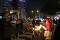 People putting Carnation flowers and lighting candles in memory of those who lost their lives on the earthquake 30 October 2020 on