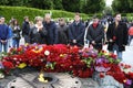 People putting flowers to the Eternal Flame in the Glory park, celebrating the Victory Day. Kyiv, Ukraine
