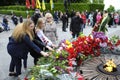 People putting flowers to the Eternal Flame in the Glory park, celebrating the Victory Day. Kyiv, Ukraine