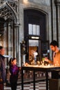 People putting memorial candles in St. Stephen`s Cathedral