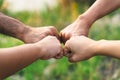 People putting their hands together. Friends making group fist bump. unity and teamwork. Friendship happiness leisure partnership Royalty Free Stock Photo