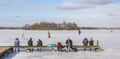 People putting on their skates at the jetty in Paterswolde