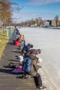 People putting on their skates at the lakeside in Paterswolde