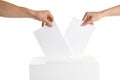 People putting their votes into ballot box on white, closeup