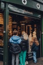 People queue at a Blackwood cheese and dairy kiosk inside Borough Market, London, UK Royalty Free Stock Photo