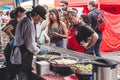 People in a queue on a food market Royalty Free Stock Photo